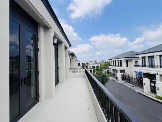 Spacious balcony with a view of the serene neighborhood