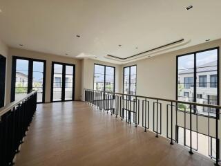 Spacious living room with large windows and abundant natural light