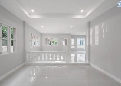 Spacious and bright unfurnished interior of a modern building with glossy white floors