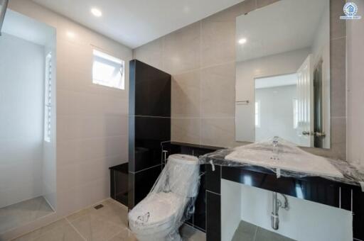Modern bathroom with neutral color tiles and new fixtures