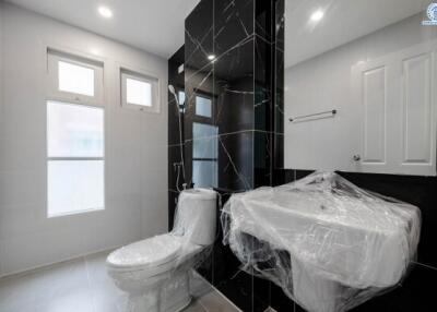 Modern bathroom interior with wrapped toilet in a new house