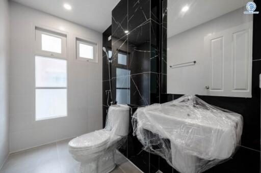 Modern bathroom interior with wrapped toilet in a new house