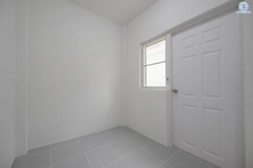 Bright empty room with window and tiled floor