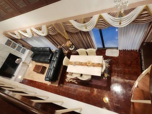 Elegant living room with luxurious furnishings and hardwood floors