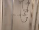 Compact shower space with glass door and electric water heater