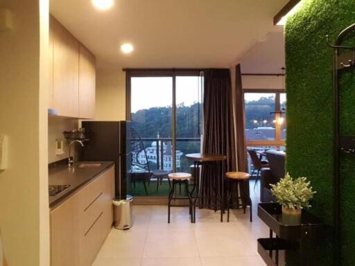 Modern kitchen with open concept adjacent to a cozy balcony