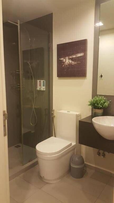 Modern bathroom interior with glass shower cubicle