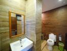 Modern bathroom with wooden tiles and white fixtures