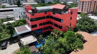 Aerial view of a modern multi-story building in an urban area