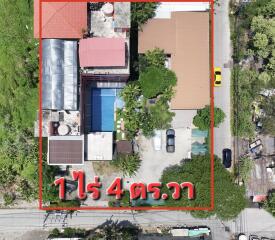 Aerial view of a residential property with swimming pool and solar panels