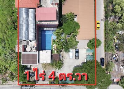 Aerial view of a residential property with swimming pool and solar panels