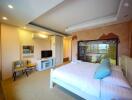 Spacious bedroom with modern amenities and en-suite bathroom