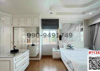 Spacious modern bedroom with ample storage and natural light