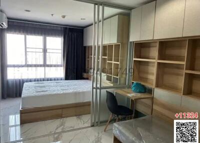 Modern bedroom with built-in wardrobe and ample shelving