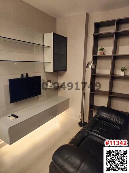 Modern living room interior with comfortable sofa and wall-mounted television