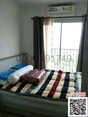 Cozy bedroom with window and air conditioning unit