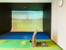 Indoor golf simulator setup in a modern entertainment room