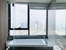 Modern bathroom with city view through large windows