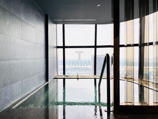 Luxurious high-rise building indoor pool with a city view