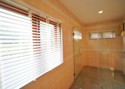 Spacious bathroom with natural light and walk-in shower