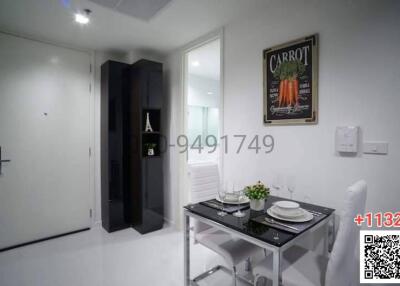 Modern dining area with a glass table and contemporary wall art