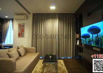 Modern living room with comfortable sofa and flat-screen TV