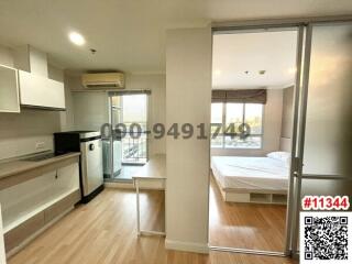 Compact and well-lit studio apartment with integrated living and bedroom space