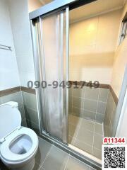 Modern bathroom interior with glass shower and toilet