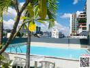 Residential building with a swimming pool and a city skyline view