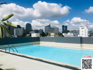 Rooftop swimming pool with city skyline view