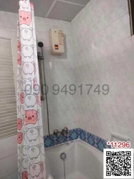 Modern bathroom with cartoon curtain design and tiled walls