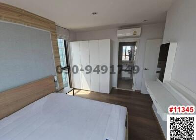 Spacious bedroom with modern furniture and ample natural light