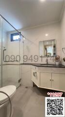 Modern bathroom with glass shower and vanity