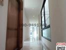 Well-lit modern hallway with large windows