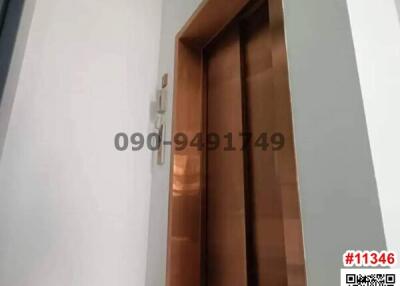 Wooden door leading to an unspecified room in a residence