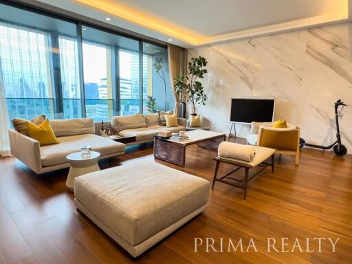 Modern living room with large windows and city view