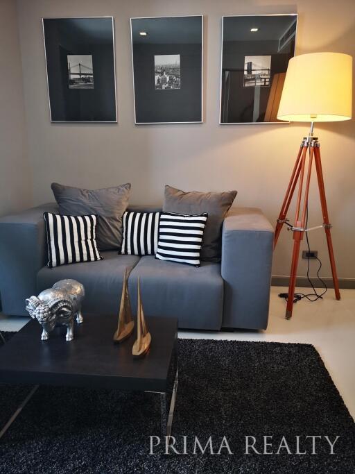 Stylish modern living room interior with comfortable sofa and home decor
