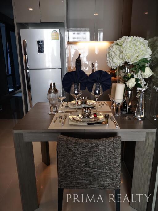 Modern kitchen with dining area setup for a meal