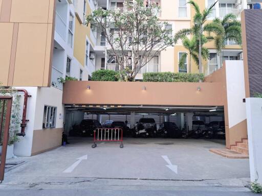 Secure parking garage entrance of a residential building with natural lighting