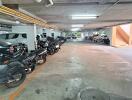 Underground parking garage with numerous motorcycle parking spaces