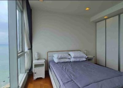 Modern bedroom with ocean view and ample natural light