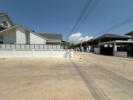 Suburban neighborhood street view with modern houses