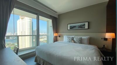 Modern bedroom with a large window and city view