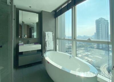Modern bathroom with freestanding tub and floor-to-ceiling windows