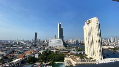 Panoramic cityscape from a high-rise balcony