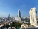 Panoramic cityscape from a high-rise balcony