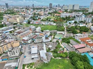 Aerial view of a dense urban area with mixed residential and commercial buildings