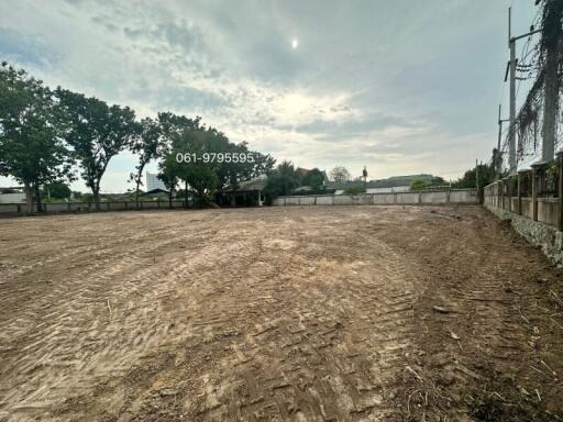 Empty plot of land ready for construction with a clear sky