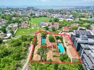 Aerial view of a residential complex with swimming pool