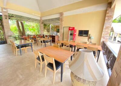 Spacious covered patio with dining area and modern furniture